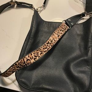 Black bag with leopard print handle